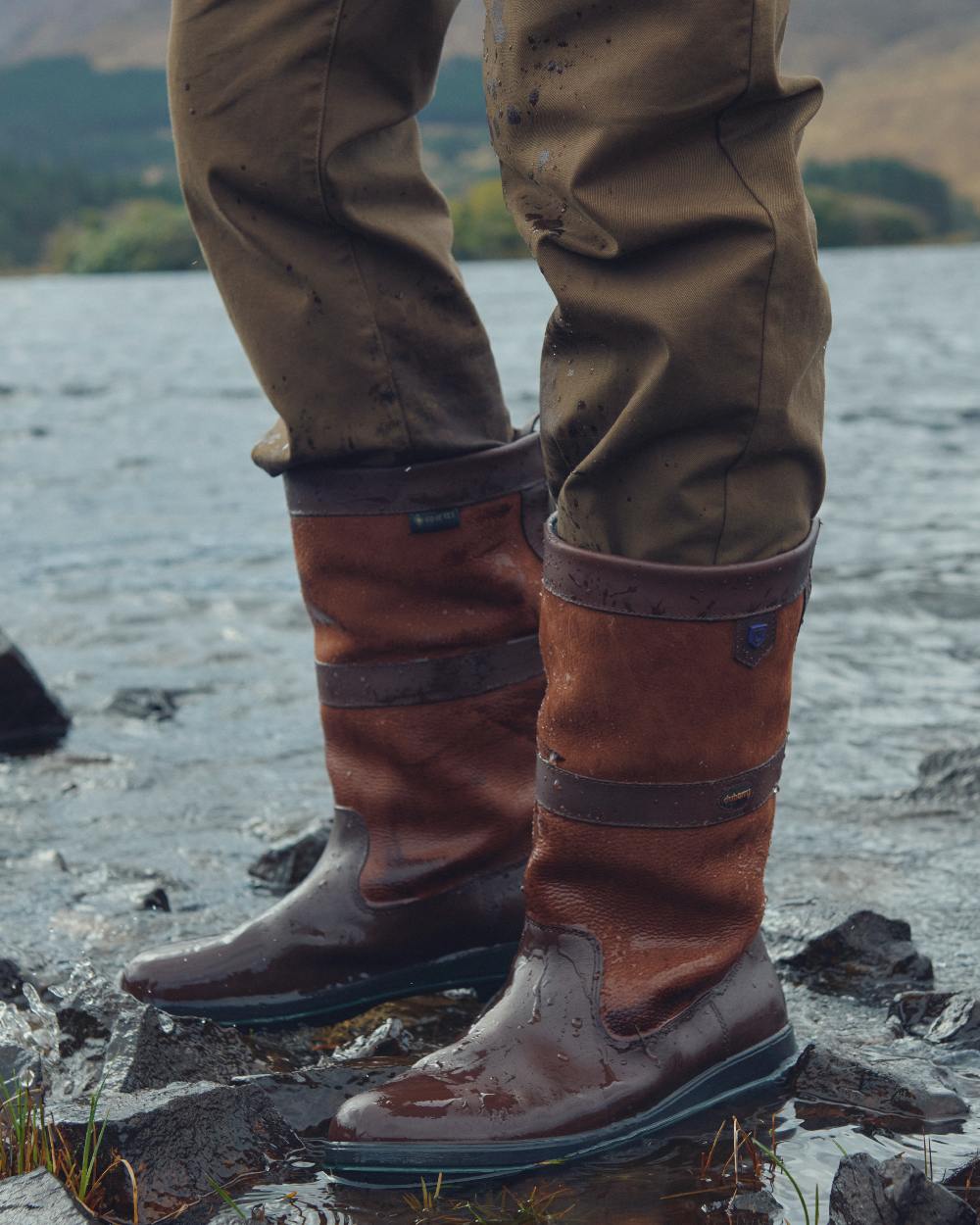 Walnut coloured Dubarry Kildare Country Boots on sea background 