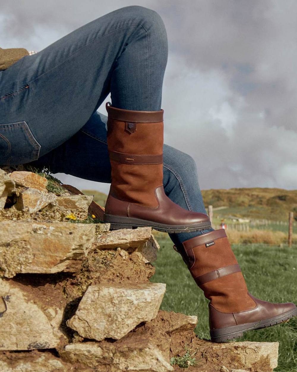 Walnut coloured Dubarry Kildare Country Boots on countryside background 