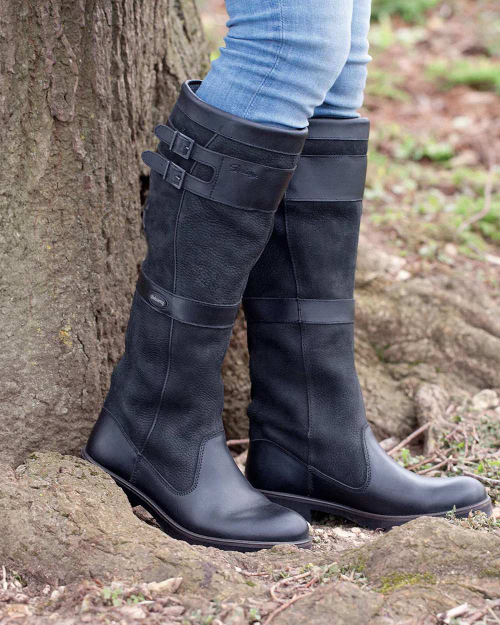 Black coloured Dubarry Longford Country Boots on tree trunk background 