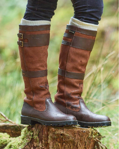 Walnut coloured Dubarry Longford Country Boots on wood background 