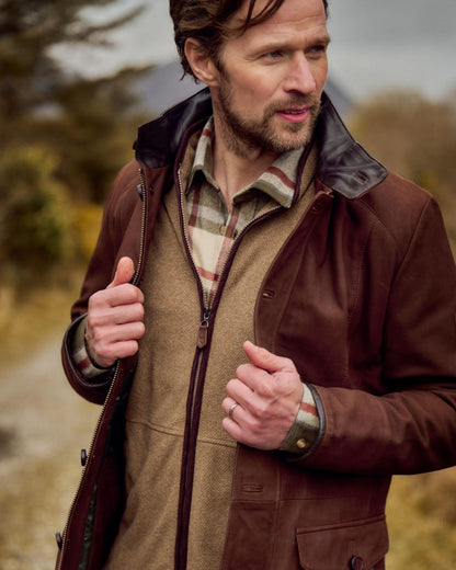Walnut coloured Dubarry Mens Moore Leather Jacket on forest background 