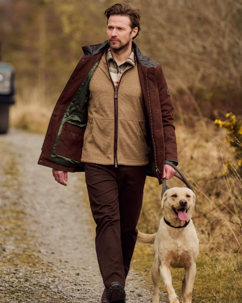 Walnut coloured Dubarry Mens Moore Leather Jacket on forest background 