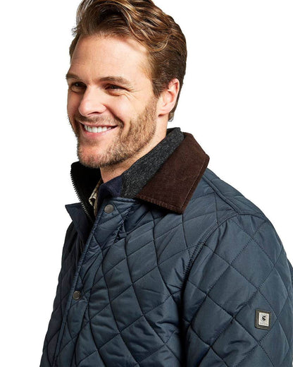 Navy coloured Dubarry Mountusher Quilted Jacket on white background 