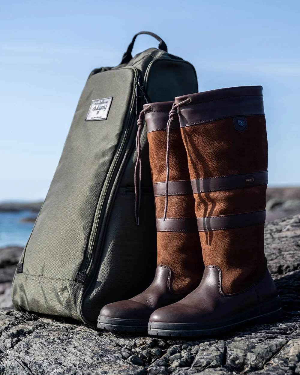 Olive Coloured Dubarry Westcourt PVC Boots Bag on outdoor background 