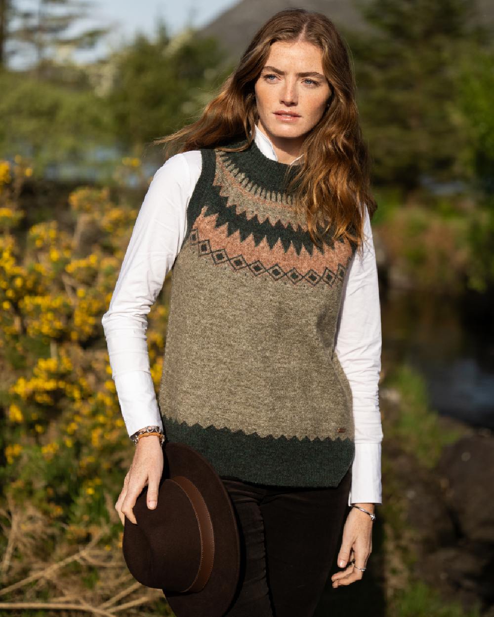 Olive Multi Coloured Dubarry Womens Doyle Fair Isle Pattern Vest on outdoor background 