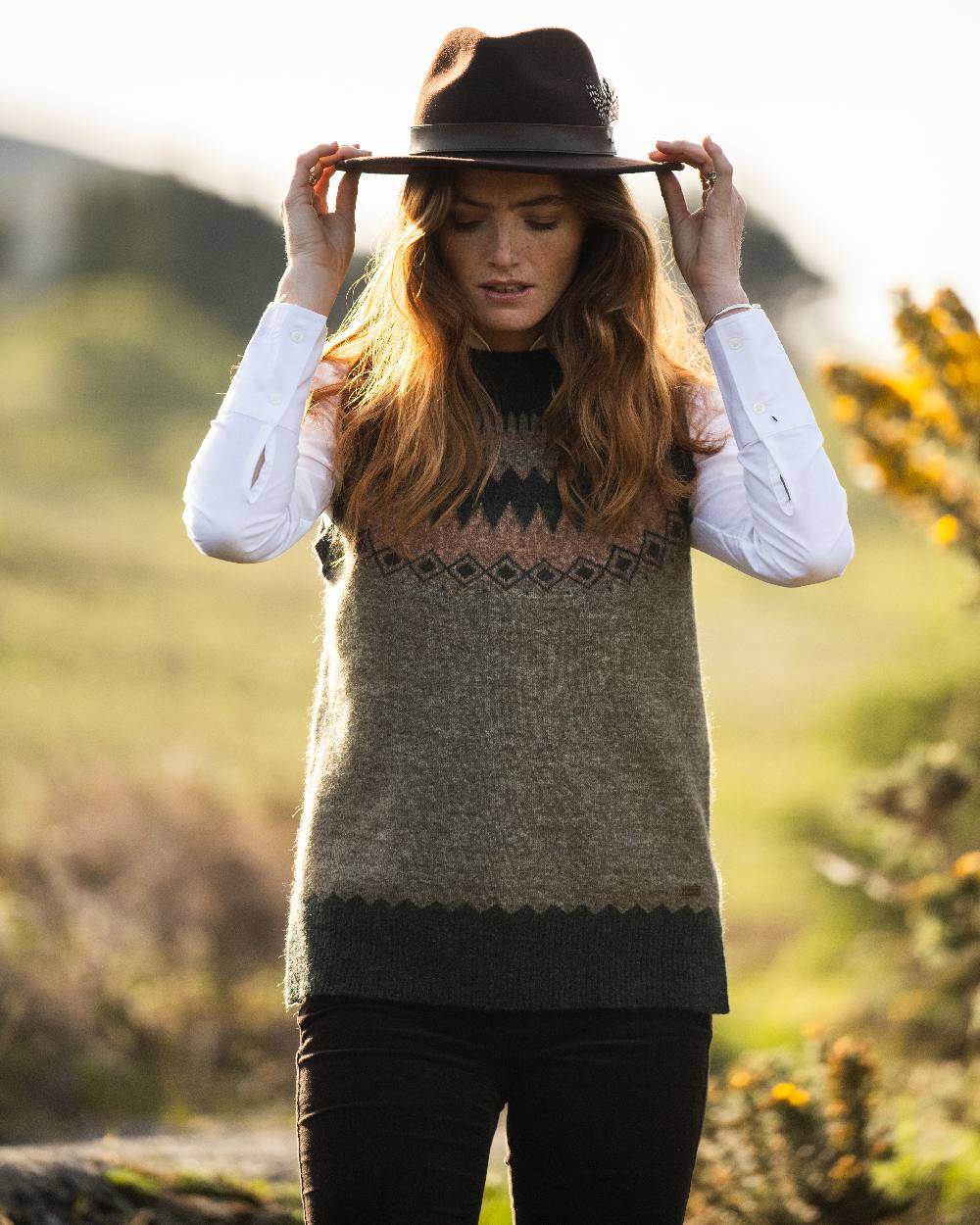 Olive Multi Coloured Dubarry Womens Doyle Fair Isle Pattern Vest on outdoor background 