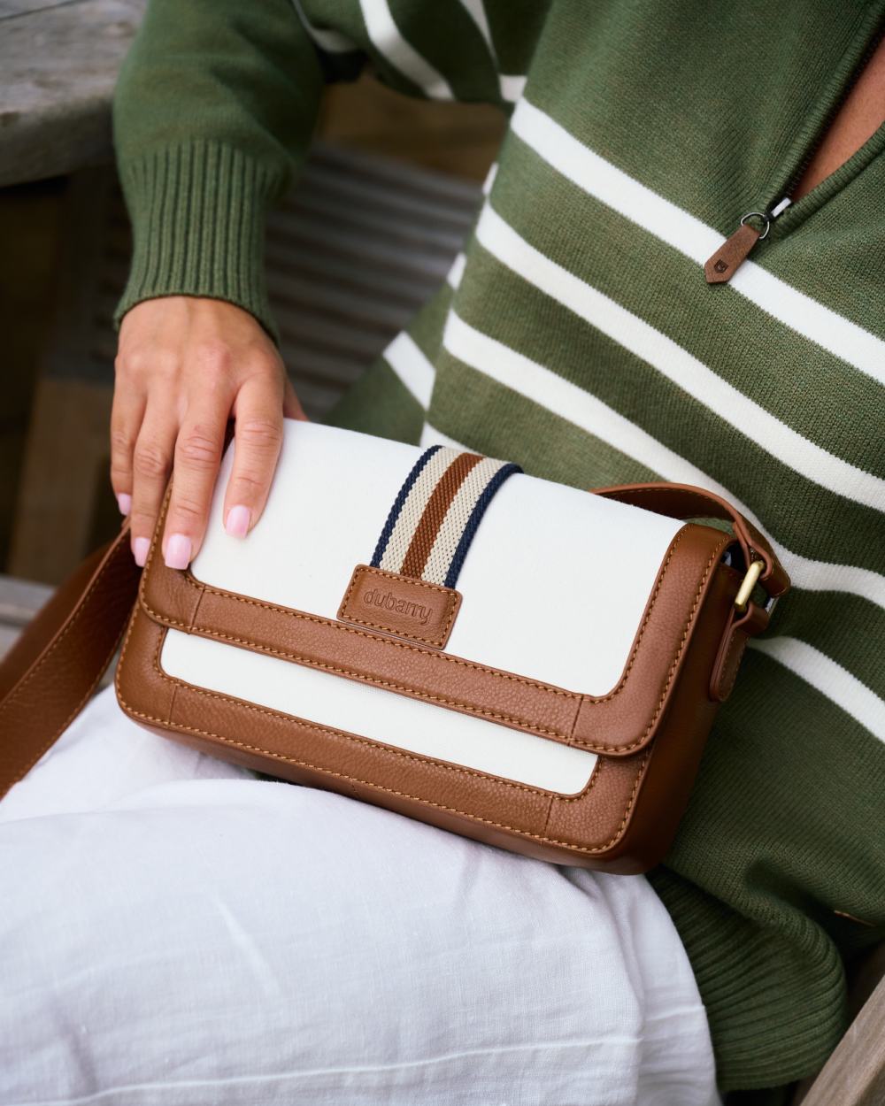Caramel coloured Dubarry Hillsbrook Cross Body Bag on outdoor background 