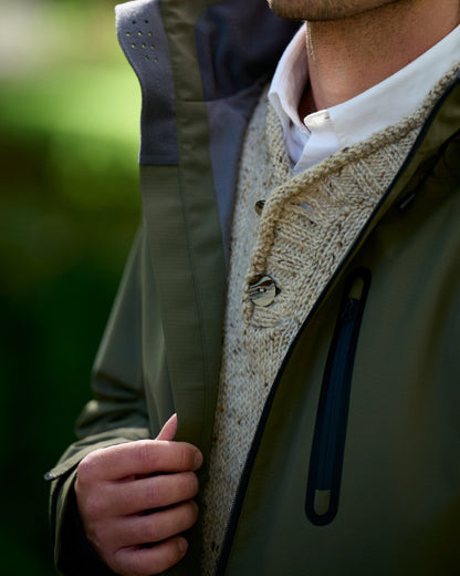 Kelp coloured Dubarry Mens Crossbarry Waterproof Jacket on outdoor background 