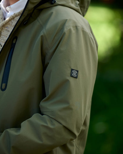 Kelp coloured Dubarry Mens Crossbarry Waterproof Jacket on outdoor background 