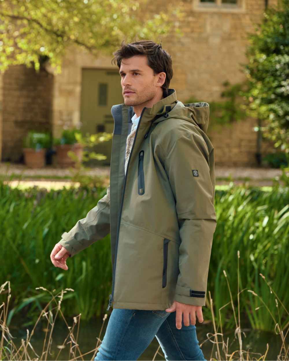 Kelp coloured Dubarry Mens Crossbarry Waterproof Jacket on outdoor background 