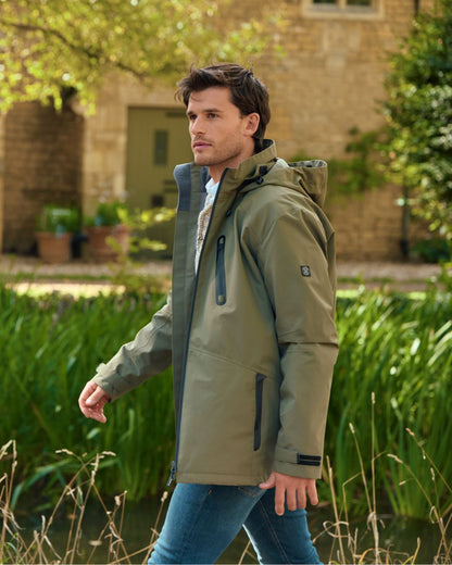 Kelp coloured Dubarry Mens Crossbarry Waterproof Jacket on outdoor background 
