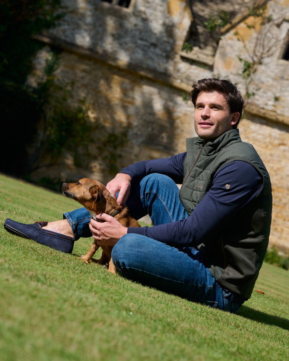 Olive coloured Dubarry Mens Solent Lightweight Hybrid Gilet on park background 