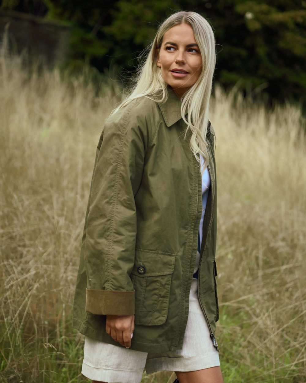 Dusky Green coloured Dubarry Womens Delaney Waxed Cotton Utility Jacket on blurry background 