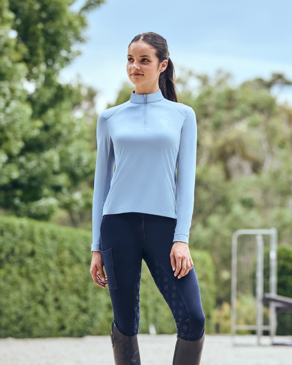 Blue Fog coloured Dublin Breathable Long Sleeve Riding Top on blurry background 