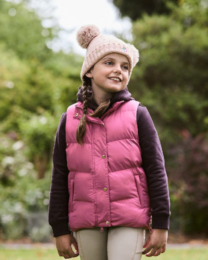 Red Violet coloured Dublin Childrens Patrice Everyday Puffer Vest on blurry background 