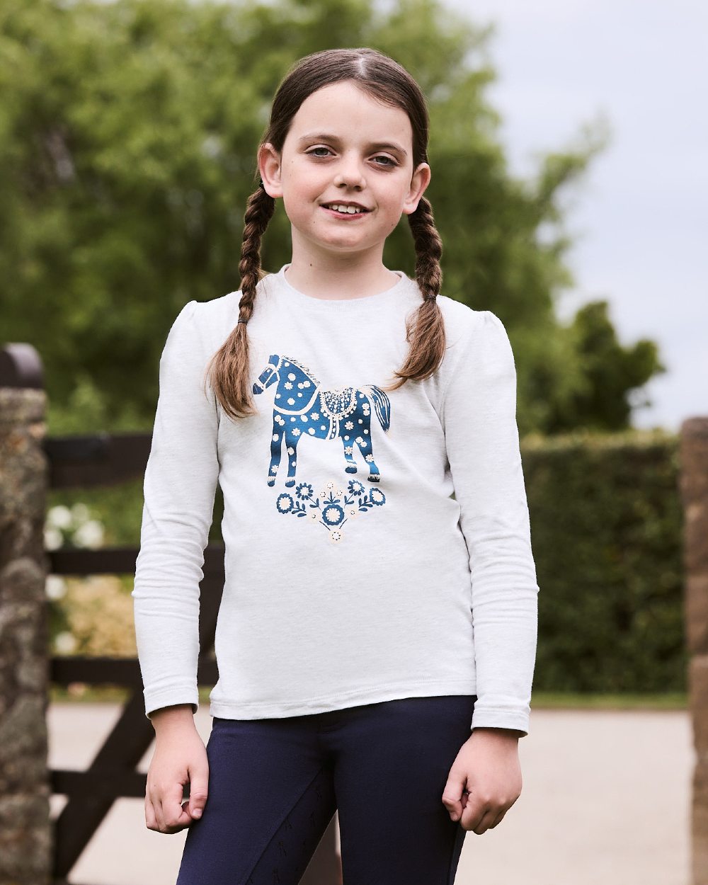 White Marle Nordic Pony coloured Dublin Childrens Poppy Puff Sleeve Tee on blurry background 