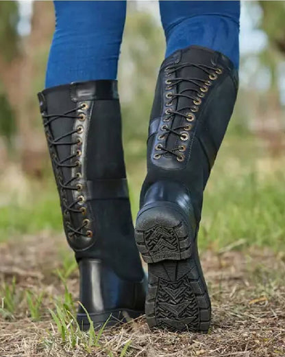 Black coloured Dublin Danman Boots on grassy background 