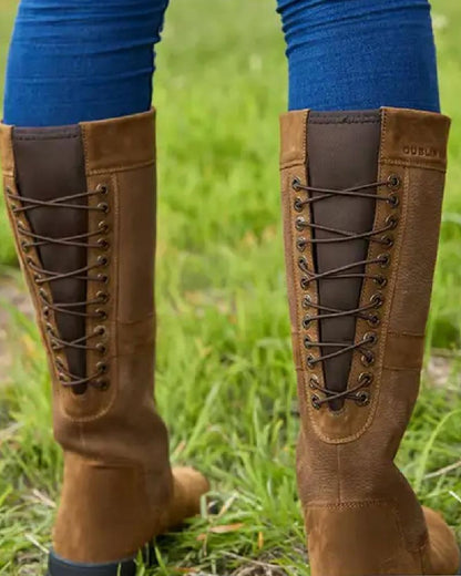 Chocolate coloured Dublin Danman Boots on grassy background 