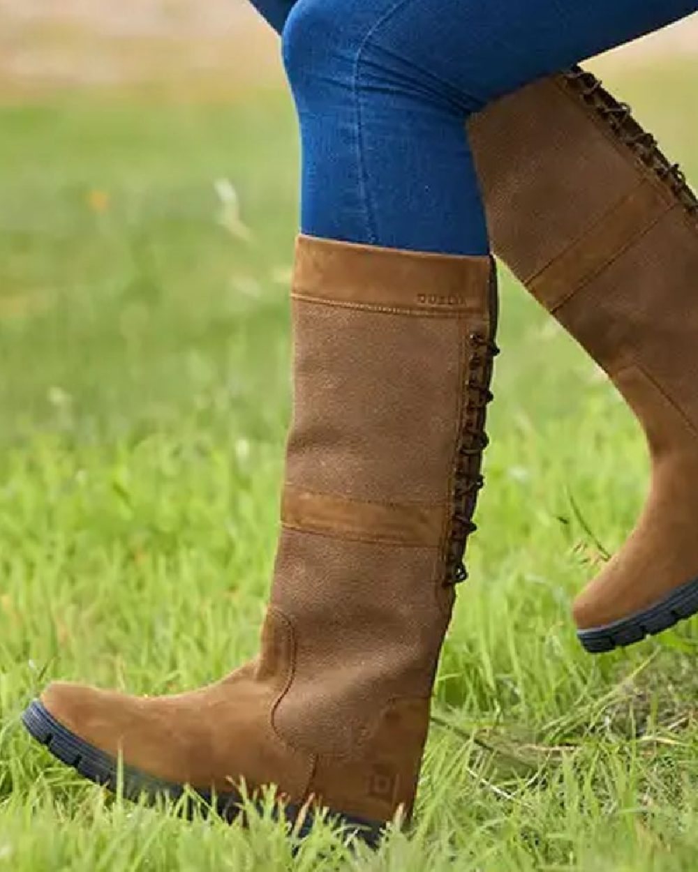 Chocolate coloured Dublin Danman Boots on grassy background 