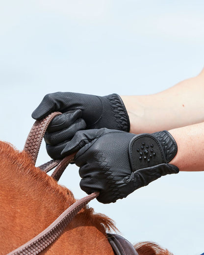 Black Coloured Dublin Everyday Bling Riding Gloves on horse background 