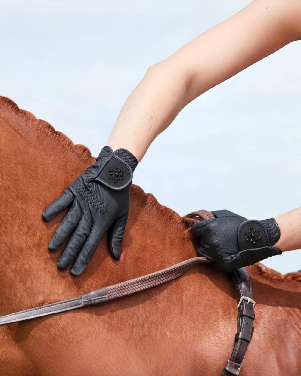 Black Coloured Dublin Everyday Bling Riding Gloves on horse background 