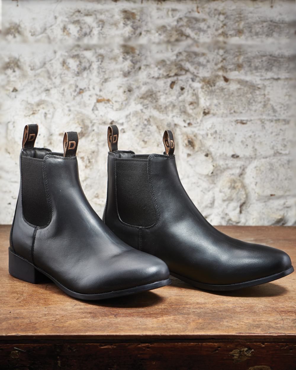 Black Coloured Dublin Foundation Jodhpur Boots II on wall background 