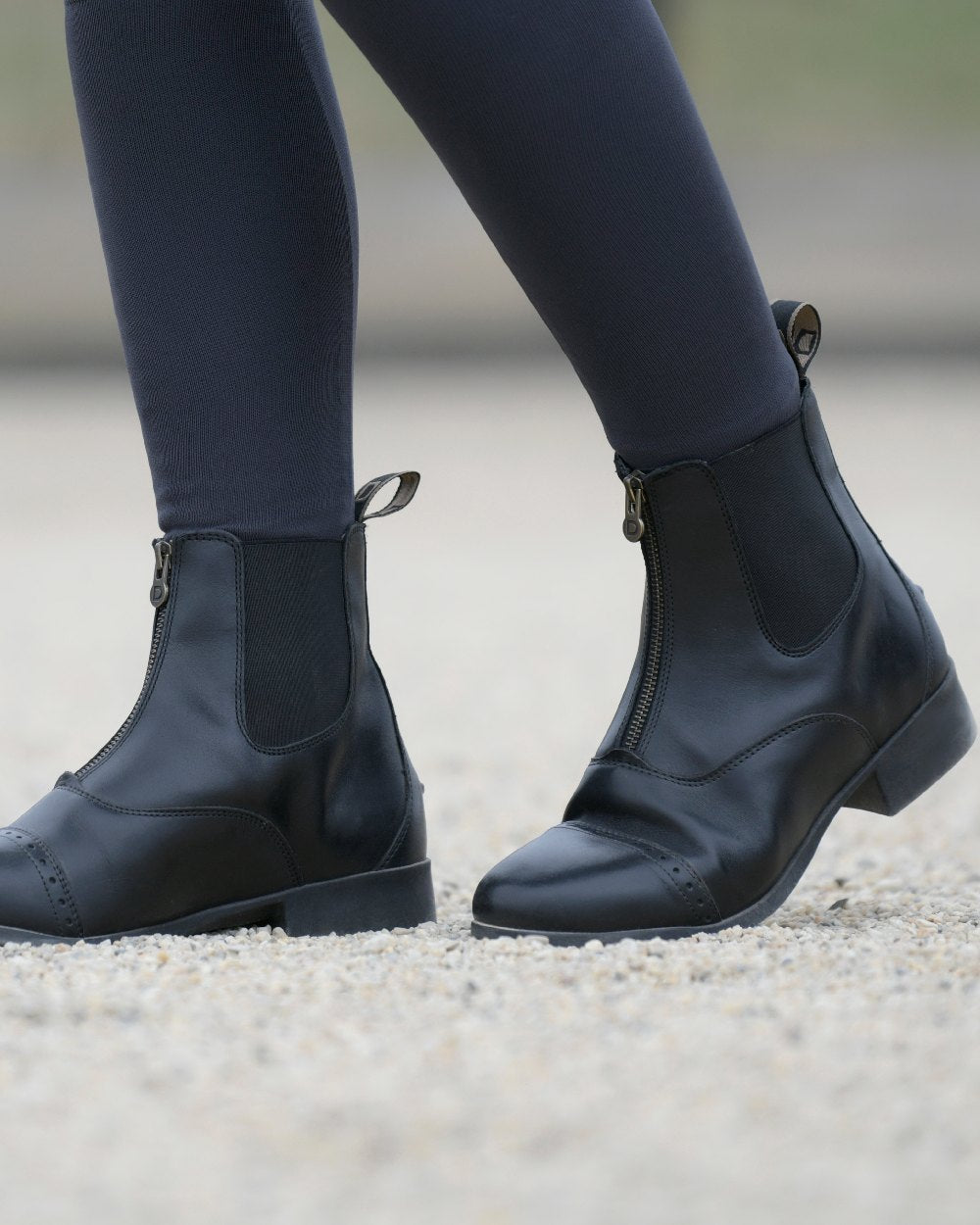 Black Coloured Dublin Foundation Zip Paddock Boots II on street background 