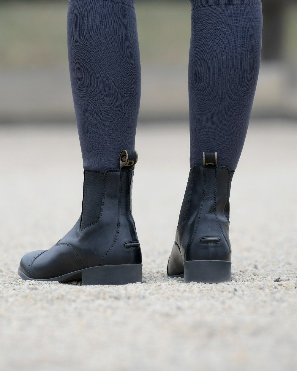 Black Coloured Dublin Foundation Zip Paddock Boots II on street background 