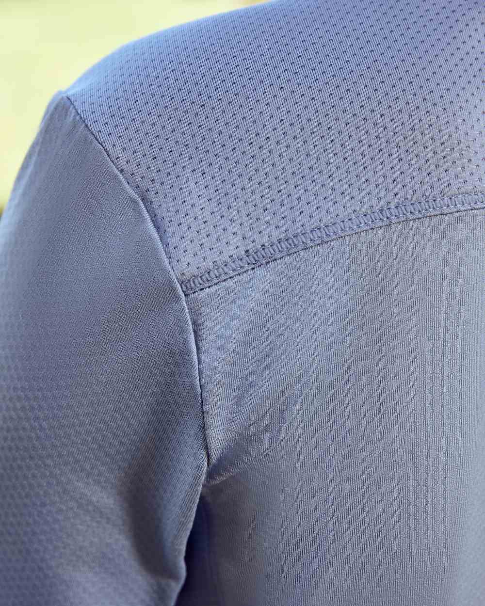 Blue Fog coloured Dublin Kids Breathable Long Sleeve Riding Top on blurry background 