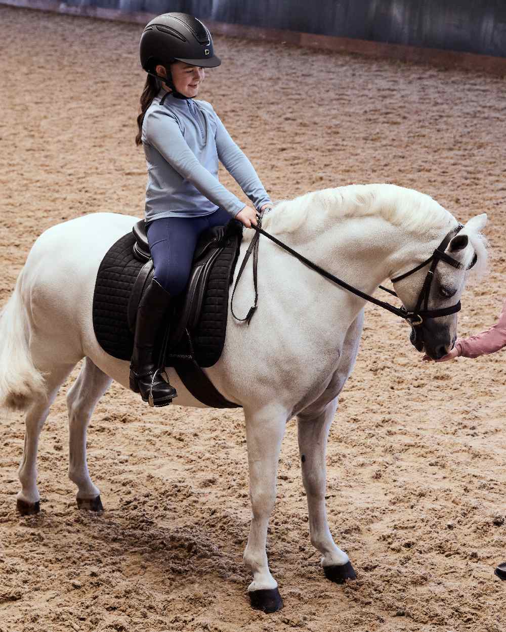 Blue Fog coloured Dublin Kids Breathable Long Sleeve Riding Top on  horse background 