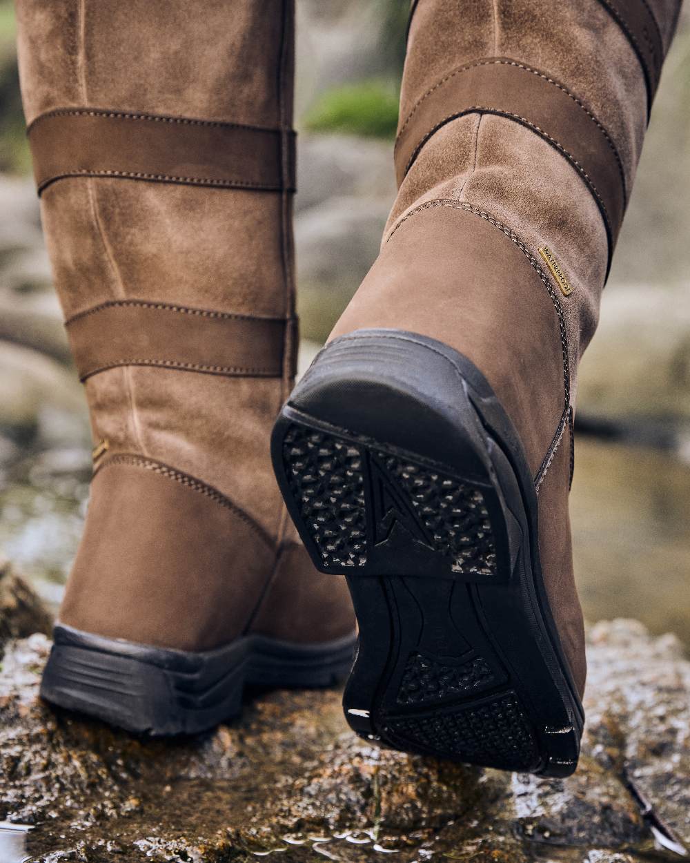 Chocolate Coloured Dublin River Boots IV on rock background 