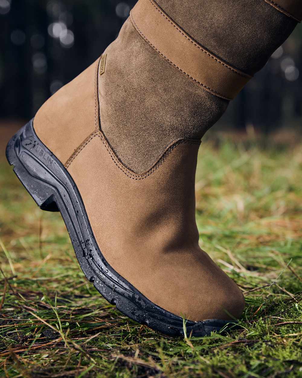 Dark Brown Coloured Dublin River Boots IV on grass background 