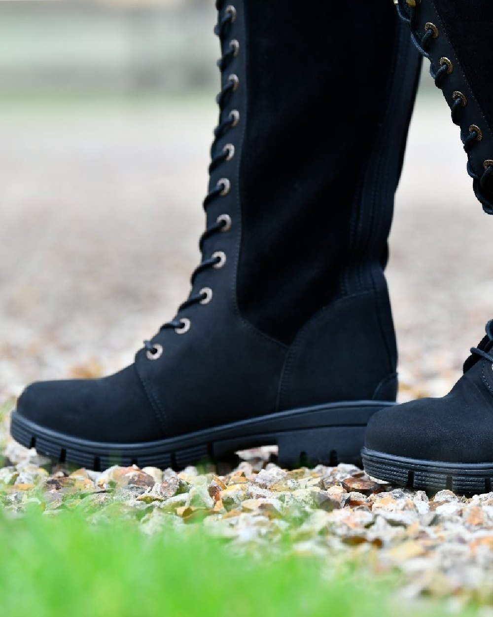 Black coloured Dublin Sloney Waterproof Boots on stone background 