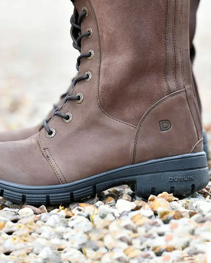 Brown coloured Dublin Sloney Waterproof Boots on stone background 