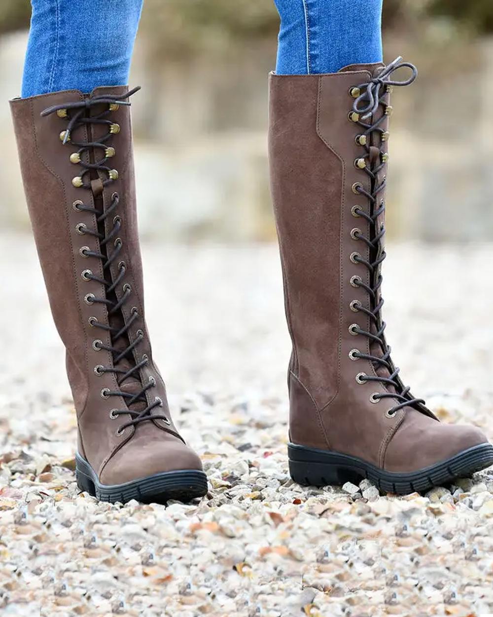 Brown coloured Dublin Sloney Waterproof Boots on stone background 