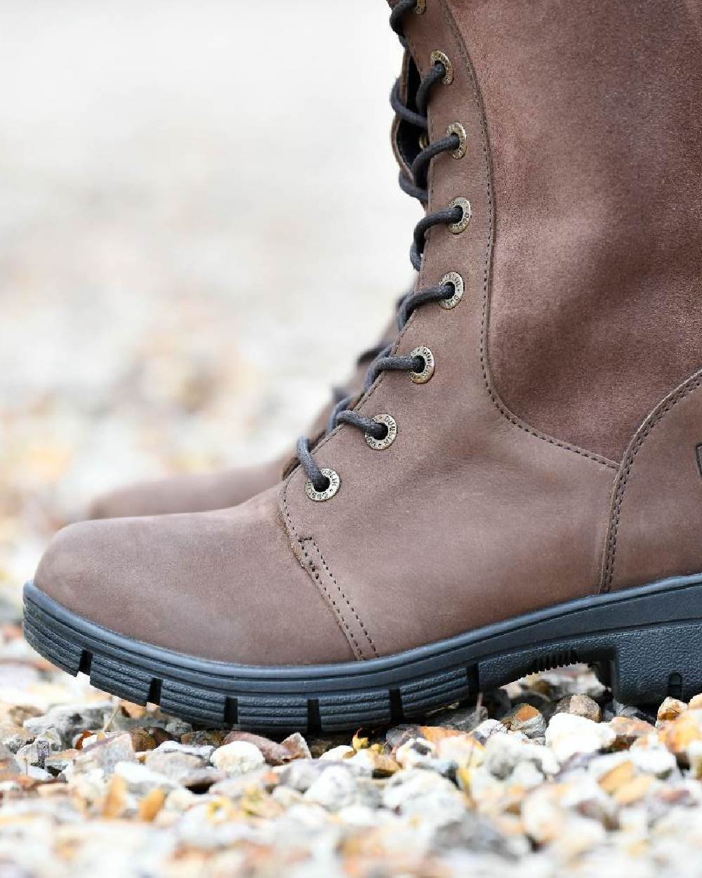 Brown coloured Dublin Sloney Waterproof Boots on stone background 