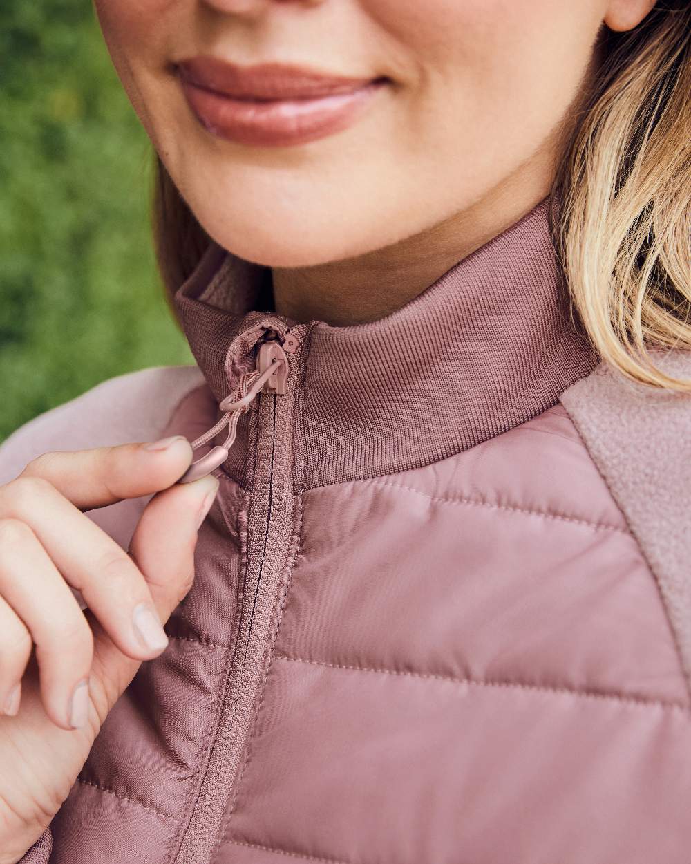 Dusty Rose coloured Dublin Womens Insulated Hybrid Jacket on blurry background 
