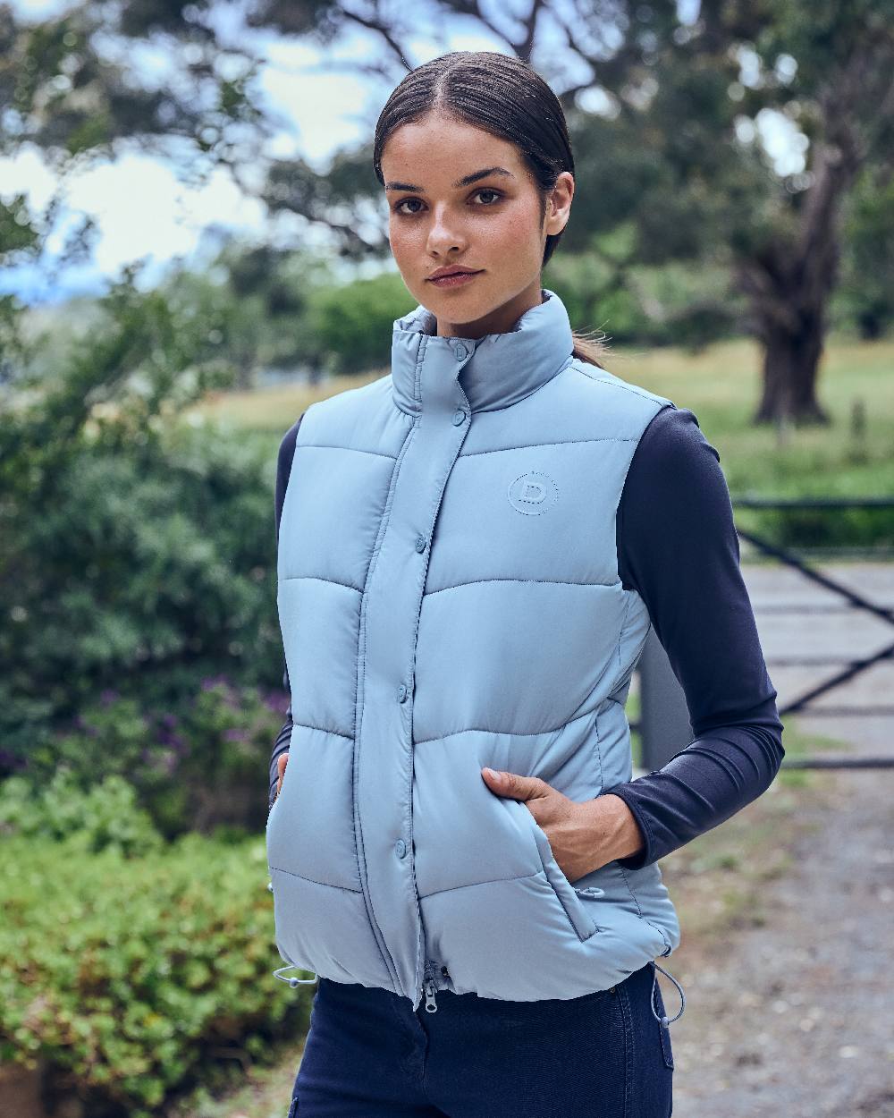 Blue Fog coloured Dublin Womens Puffer Body Warmer on barn background 