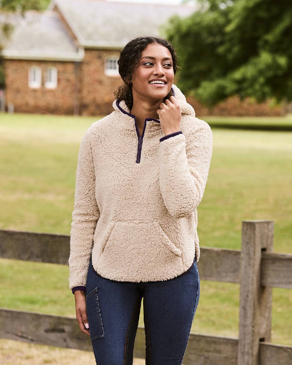 Natural Plum Perfect Trim coloured Dublin Womens Talia Teddy Pullover on blurry yard background 