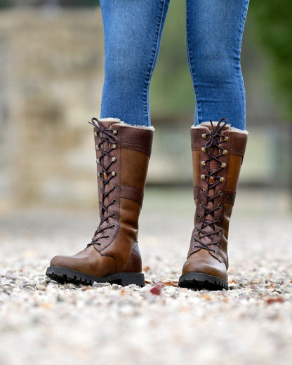 Brown Coloured Dublin Yukon Boots on blurry background 