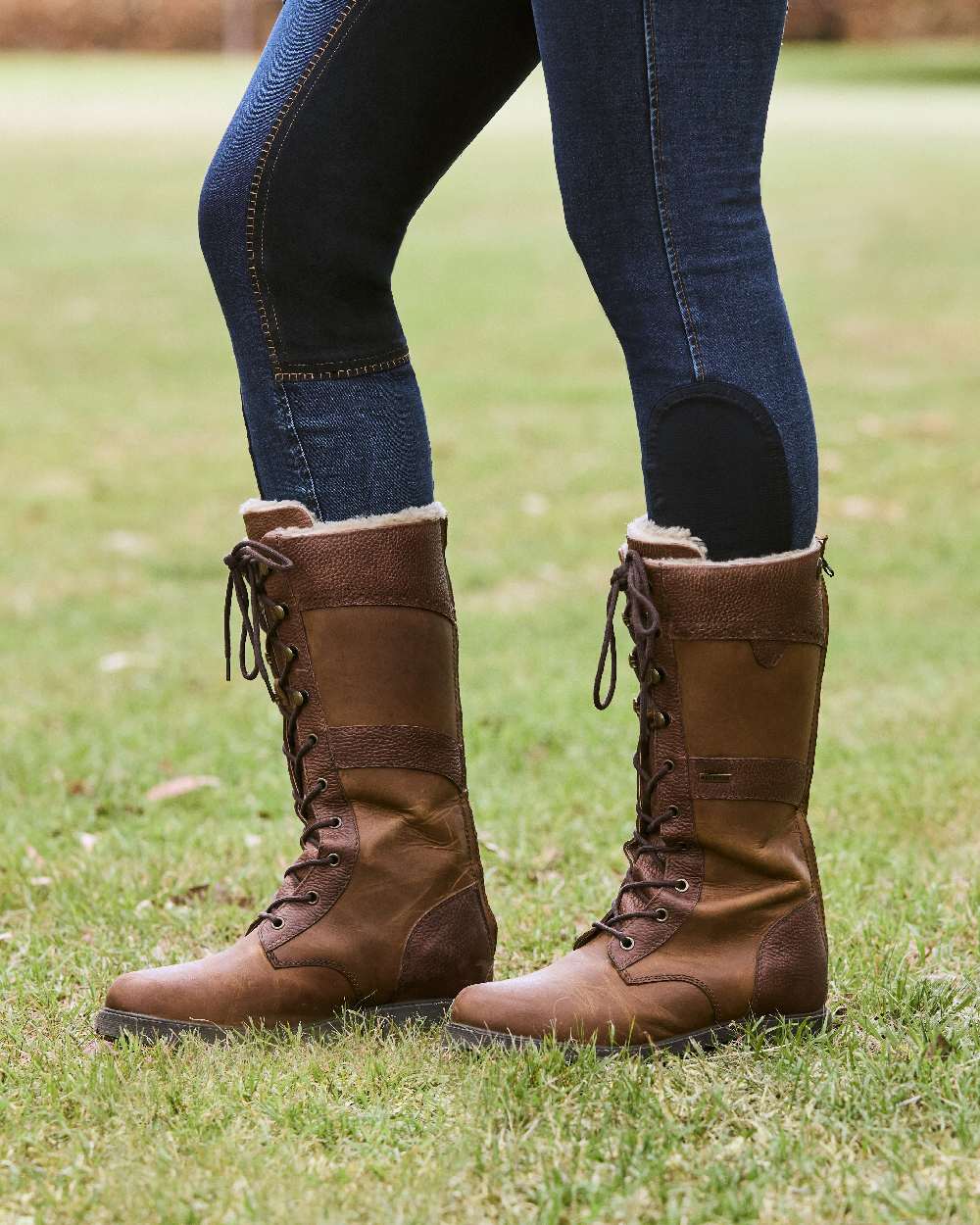 Brown Coloured Dublin Yukon Boots on land background 