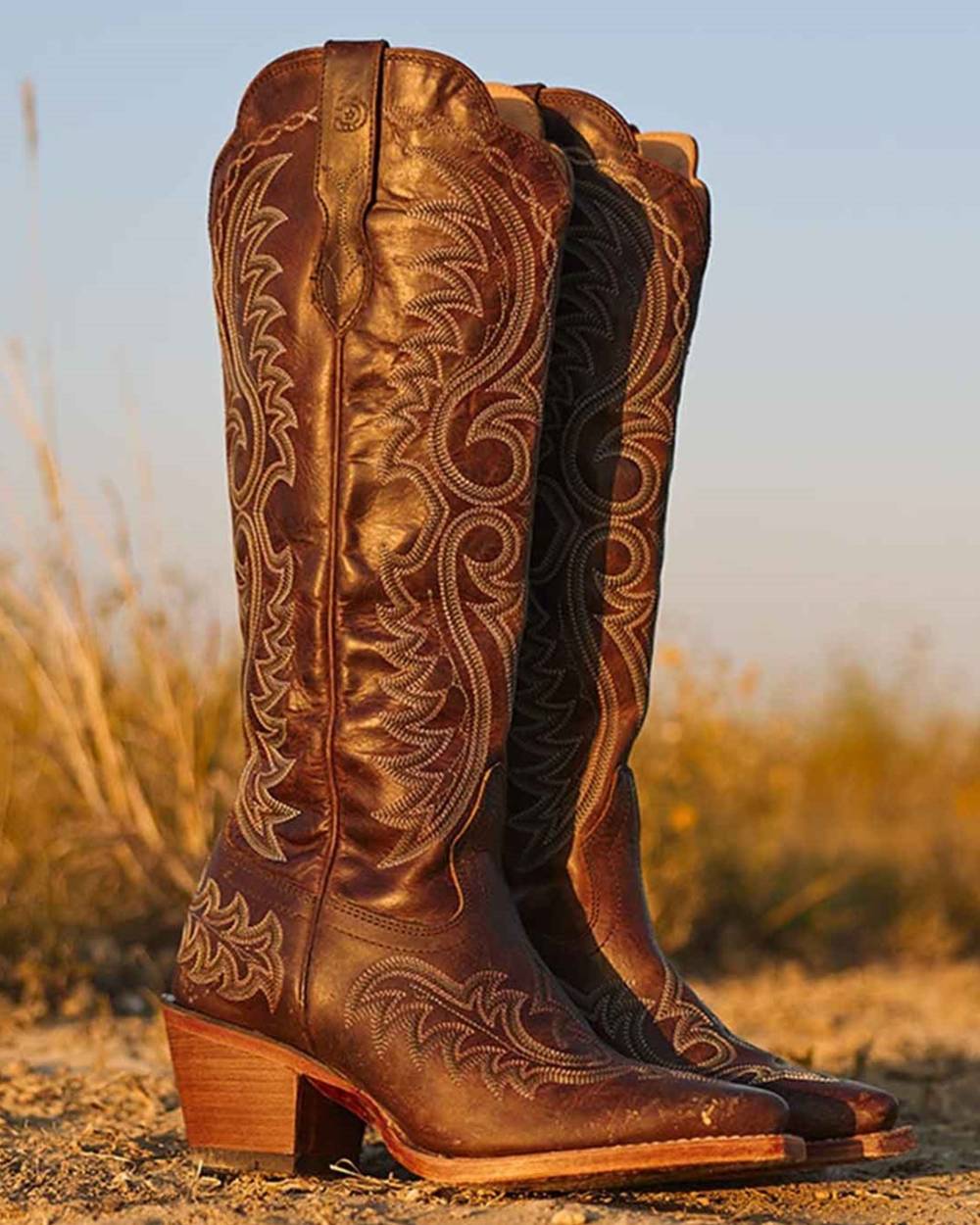 Mahogany coloured Durango Womens Crush Tall Western Boots on  outdoor background 
