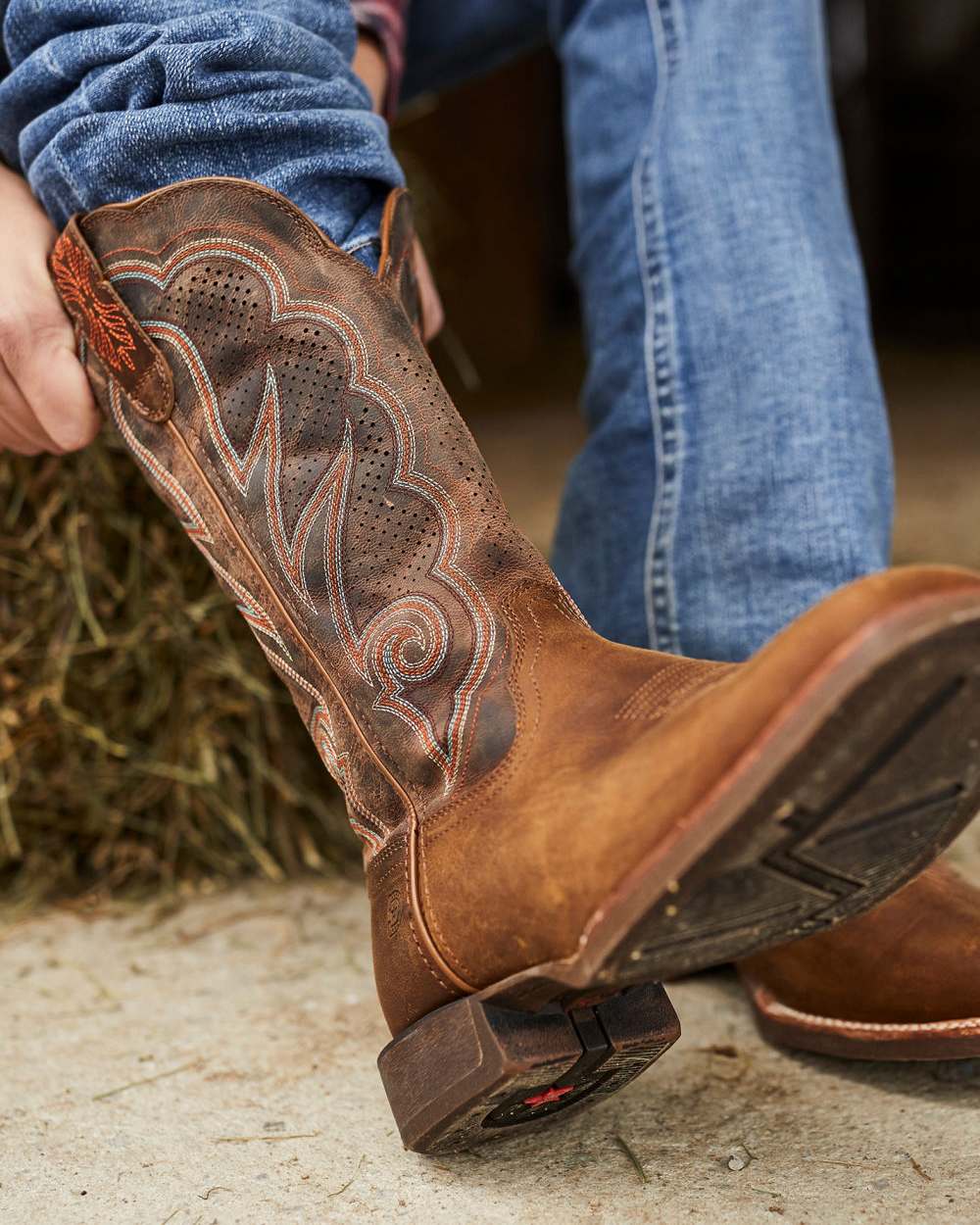 Distressed Cognac coloured Durango Womens Rebel Pro Western Boots on blurry background 