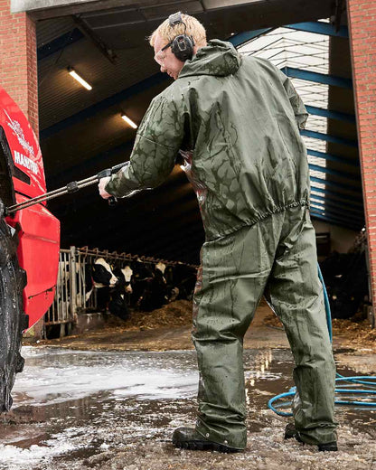 Olive Coloured Elka Light Jacket on construction background 