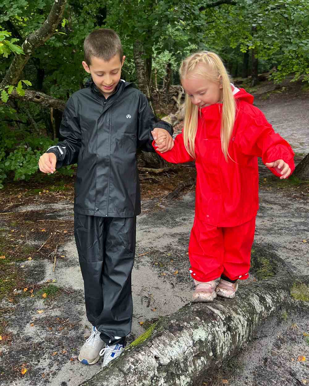 Black Coloured Elka Childrens Rain Set on forest background 