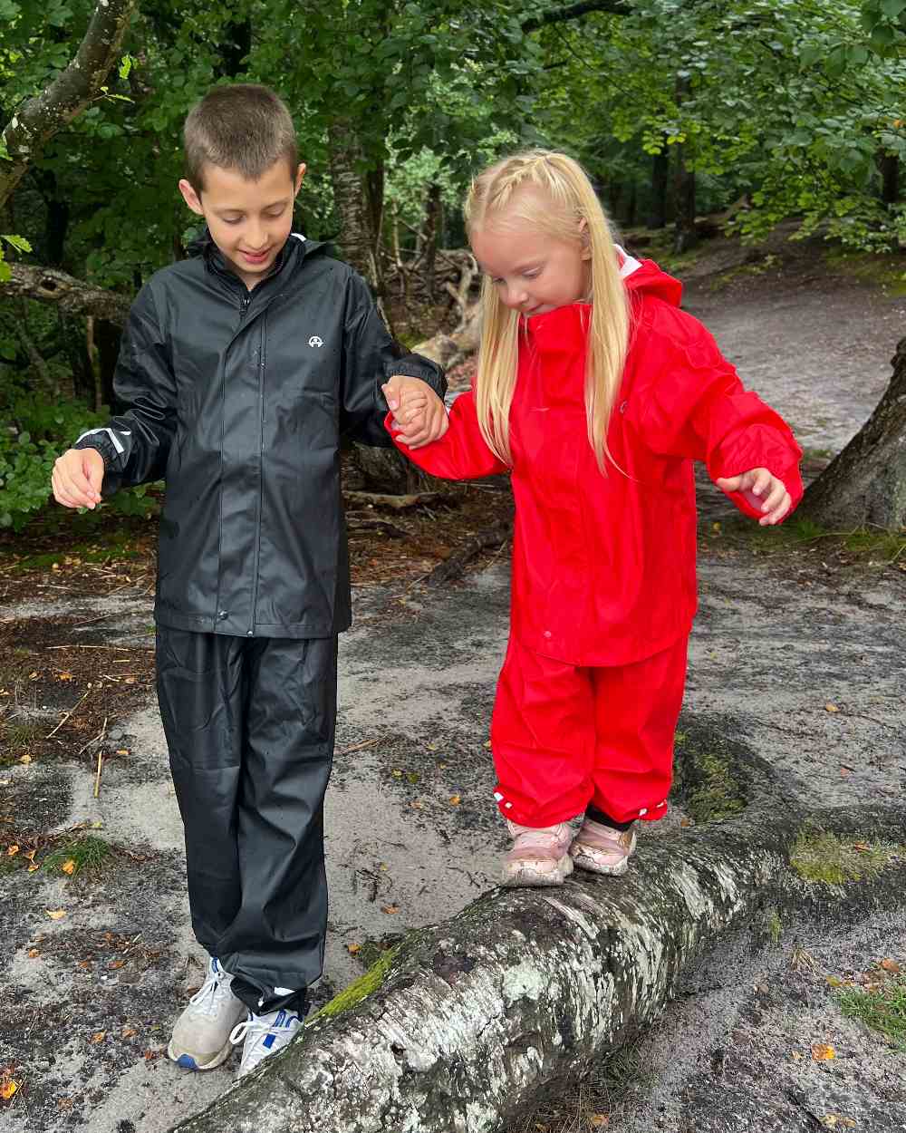Red Coloured Elka Childrens Rain Set on forest background 