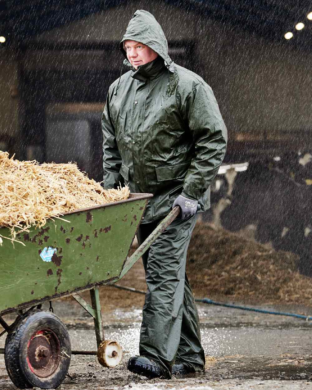 Olive Coloured Elka Mens Dry Zone PU Rain Jacket on rain background 