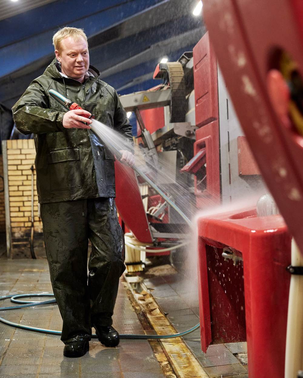 Olive Coloured Elka Mens Jacket on construction background 