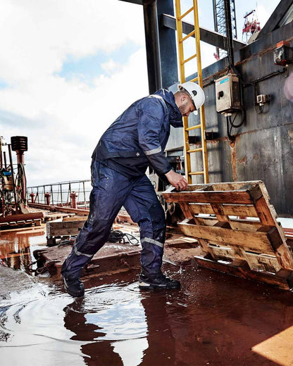 Navy Black Coloured Elka Mens Working Xtreme Stretch Jacket on construction background 