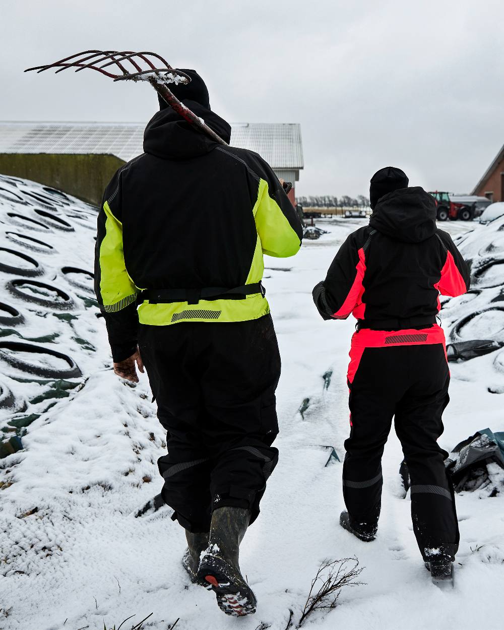 Black Fluorescent Yellow Coloured Elka Mens Working Xtreme Winter Thermal Coverall With Recycled Padding on snow background 
